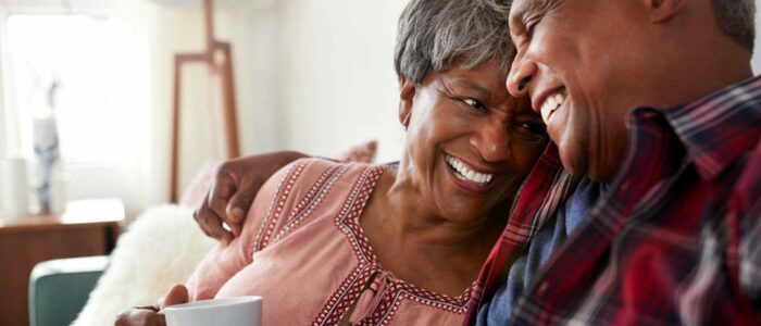 elderly couple on a couch